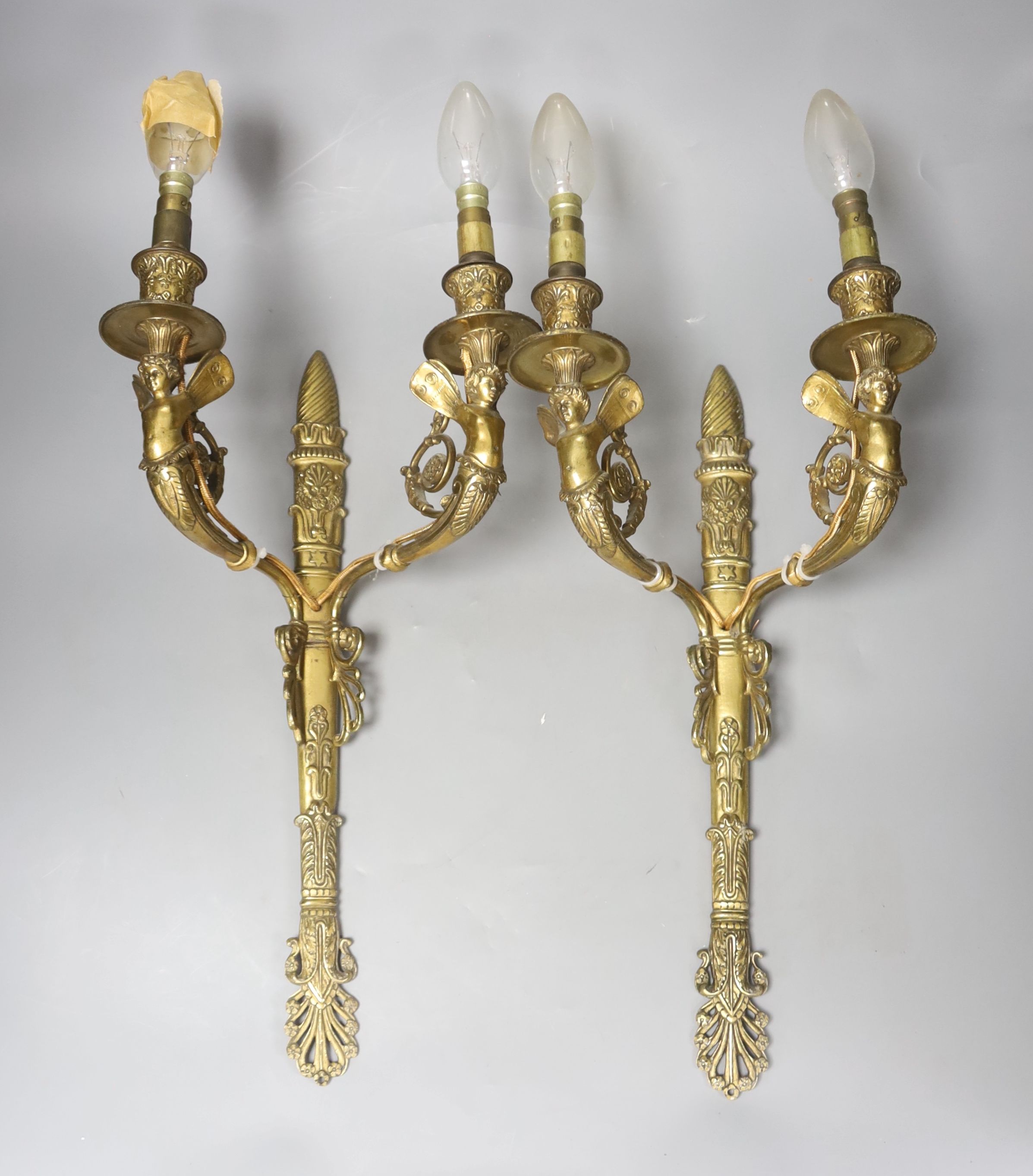 A pair of two branch ormolu wall lights with cherubs, height 42cm